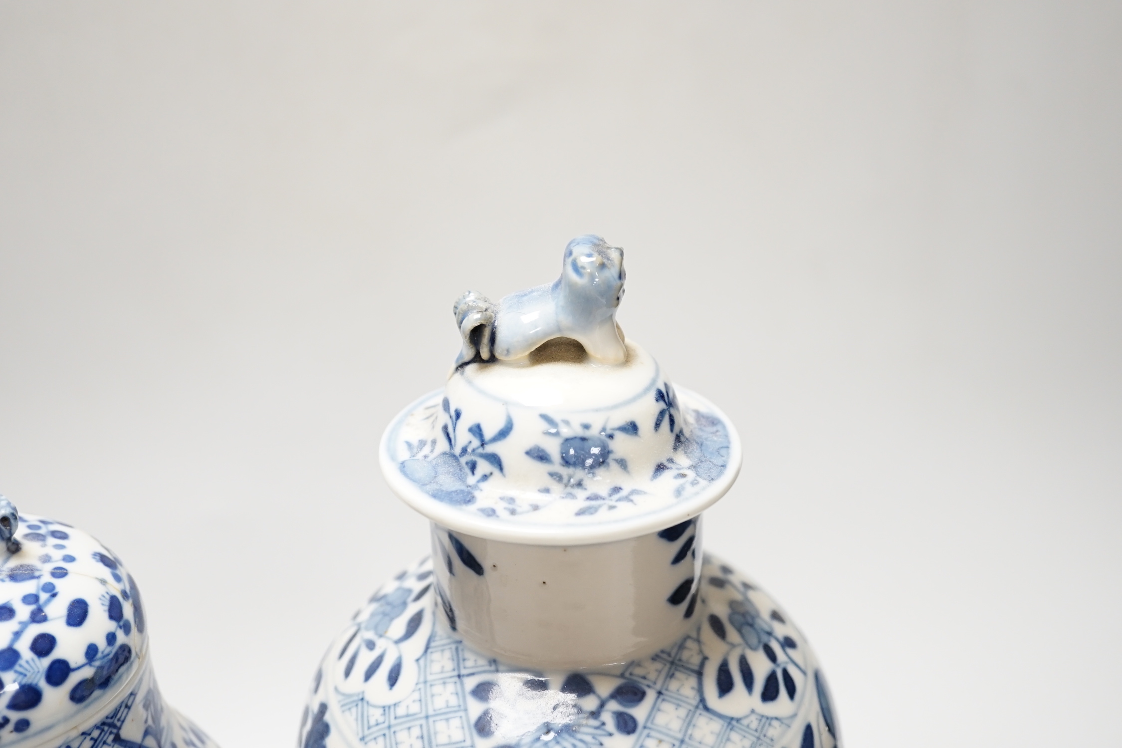 A Chinese blue and white ‘dragon’ vase and cover, and another, tallest 32cm; some damage